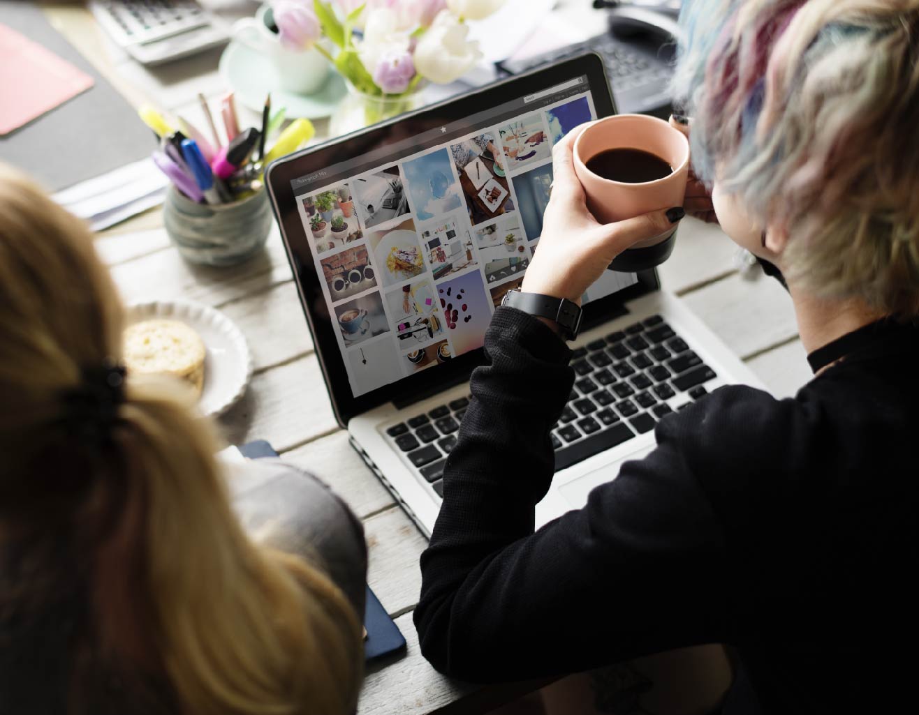 woman-hands-holding-coffee-cup-working-on-laptop-2025-02-10-05-49-13-utc-01